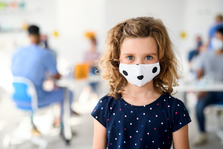 Portrait of child with face mask, coronavirus, covid-19 and vaccination concept