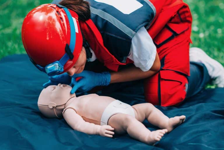 Cpr training on baby dummy